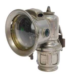 A Lucas Galcia Major carbide/acetylene bicycle lamp, set with faceted red and green glass...