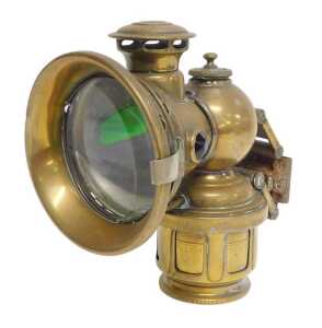 A Joseph Lucas Ltd Birmingham 260E Colonia brass effect carbide/acetylene bicycle lamp, inset...