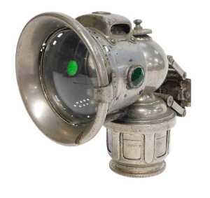 A Joseph Lucas Ltd Birmingham carbide/acetylene bicycle lamp, inset with faceted red and green...