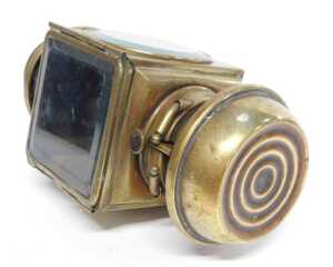 An E&J Detroit brass effect car paraffin side light, inset with a faceted red glass roundel,... - 5