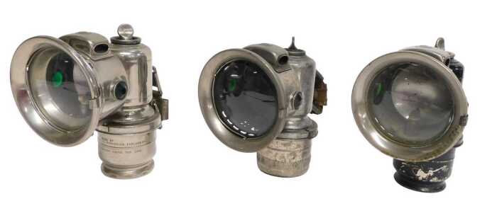 Three Joseph Lucas Ltd Birmingham carbide/acetylene bicycle lamps, one painted black, each inset...