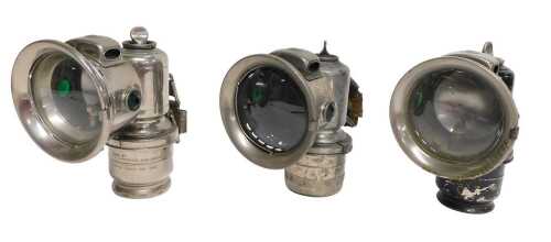 Three Joseph Lucas Ltd Birmingham carbide/acetylene bicycle lamps, one painted black, each inset...