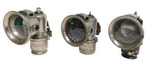 Three Joseph Lucas Ltd Birmingham carbide/acetylene bicycle lamps, one painted black, each inset...