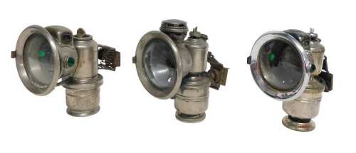 Three Powell and Hanmer Ltd Birmingham Panther carbide/acetylene bicycle lamps, two inset with...