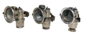 Three Powell and Hanmer Ltd Birmingham Panther carbide/acetylene bicycle lamps, two inset with...