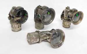 Four Miller Bola carbide/acetylene bicycle lamps, each inset with faceted green glass roundels,... - 4