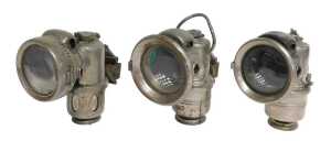 Three Powell and Hanmer carbide paraffin lamps, one titled Chieftain, 16cm high, and another The...