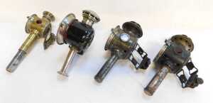 Four candle bicycle lamps, two for Luxor, 24cm high, a brass effect finish example, and another... - 3