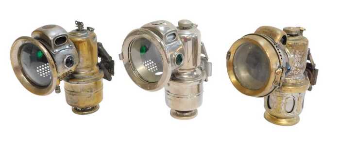 Three Powell and Hanmer carbide/acetylene bicycle lamps, comprising Chieftain, 17cm high, The...