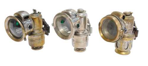 Three Powell and Hanmer carbide/acetylene bicycle lamps, comprising Chieftain, 17cm high, The...