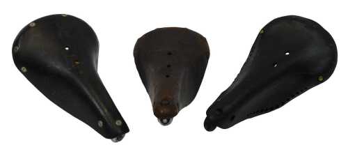 A Norex 38 leather saddle, with copper and brass rivets, an Ideal 80 leather saddle, and a...