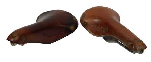 A Brooks Swift leather saddle, together with a Brooks Professional tan leather saddle, with...