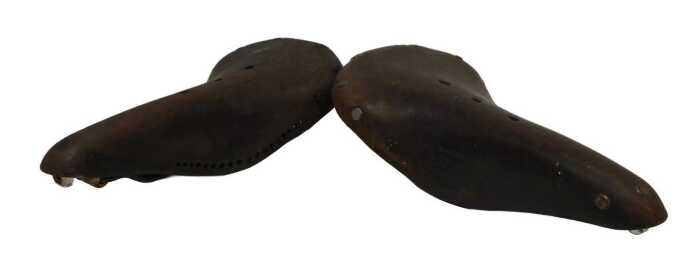 A Brooks B17 Champion narrow leather saddle, and another Brooks saddle. (2)