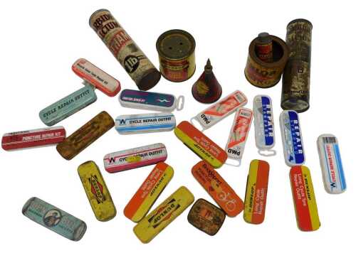 Various puncture repair kit tins, including a Dunlop repair outfit tin, Dunlop cycle valve...