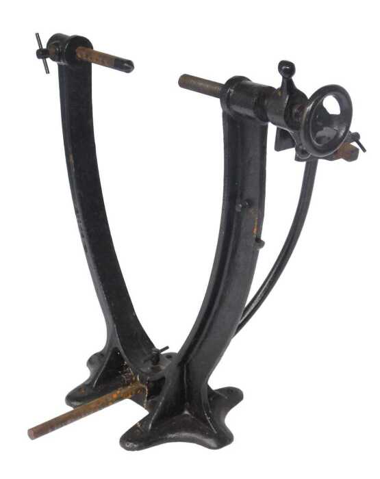 A black painted cast metal bicycle work stand, 44cm high.