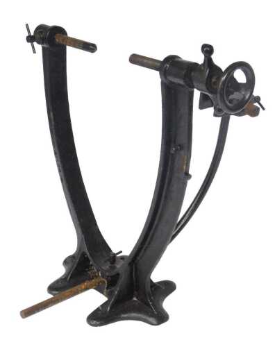 A black painted cast metal bicycle work stand, 44cm high.