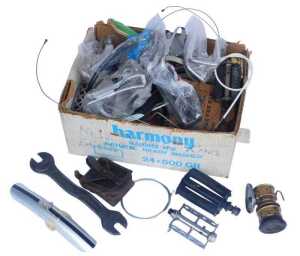 Various bicycle spares and tools, including pedals, cables, small mudguards, Campagnolo cables...