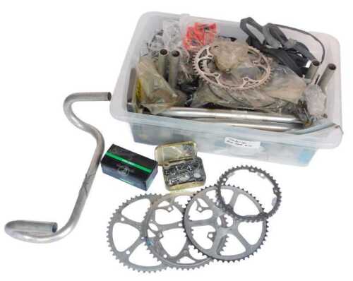Bicycle parts, including chromed handlebars, various cranks, a Campagnolo Veloce bottom bracket,...