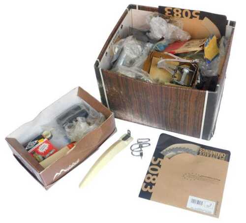 Various bicycle parts, including crank wheels, various gear levers, cables, rim tape, pedal...