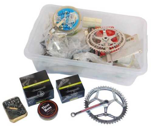Various bicycle parts, including crank, Campagnolo triple rear derailleur, a Campagnolo triple...