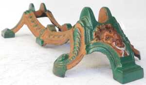 Various cast iron wheel stands, to include a green and bronze painted example with lion's head. - 5
