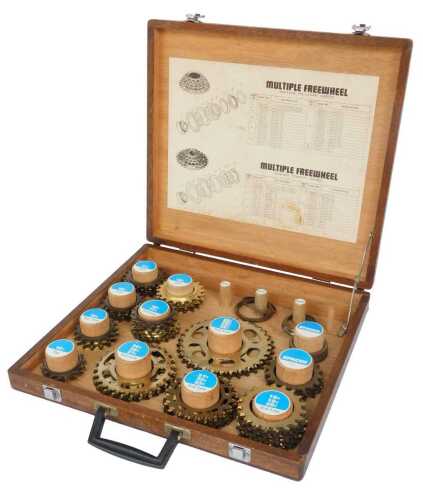 A Sun Tour multiple free wheel set, in a teak fitted case.