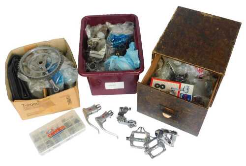 Bicycle spares, including brake sets, derailleurs, bolts, pedals, crank sets, etc. (1 shelf)