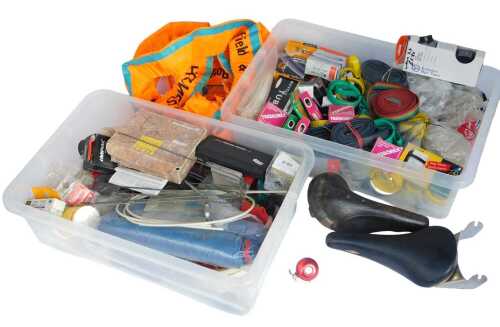 Bicycle parts, including inner tubes, handlebar tape, Campagnolo cables, bearing sets, a Brooks...