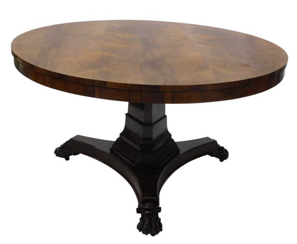 A William IV rosewood breakfast table, the circular top on a triangular ...
