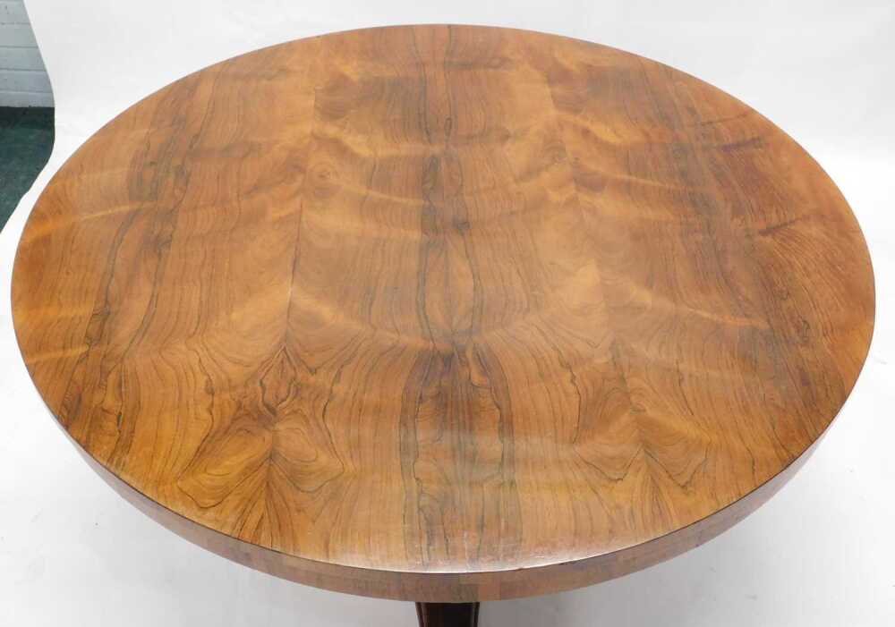 A William IV rosewood breakfast table, the circular top on a triangular ...