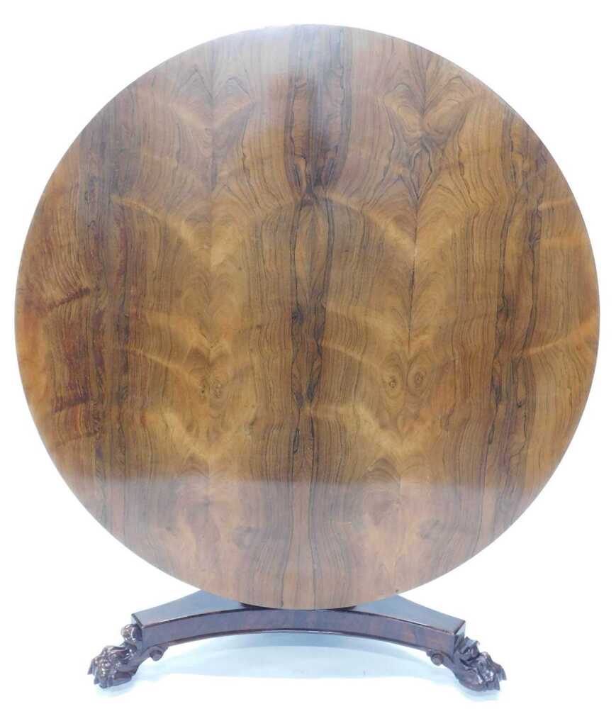 A William IV rosewood breakfast table, the circular top on a triangular ...