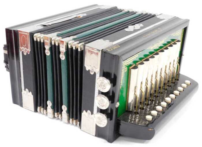 A Commander melodeon, ten button, in partial box.