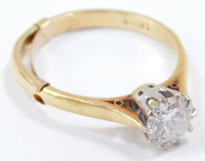 A diamond solitaire ring, high claw set in yellow metal, stamped 18ct, approx 1ct, size Q, 3.6g. - 3