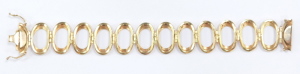 A 9ct gold oval twelve link bracelet, on a snap clasp, 32.6g. - 2
