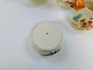 An early 20thC Portland Pottery Company pottery tea and coffee hunting service, moulded with fox mask spouts. - 2