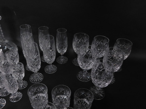 An extensive suite of cut crystal drinking glasses, together with a 'Georgian Crystal' globe and shaft decanter, ornamental shoe, and a water jug (AF). (a quantity) - 2