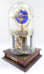 A Chinese brass and marble astrolabium clock, showing the globe and moon, cylindrical twenty four hour dial, raised on Doric columns, above a square mahogany base, with glass dome, 32cm high. - 2