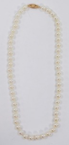 A cultured pearl necklace, on a yellow metal hook clasp, stamped 14K, each pearl approx 7mm diameter. - 3
