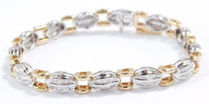A baguette diamond bracelet, set in a white oval and yellow square metal link bracelet, stamped 14k, on a snap clasp, approximately 2ct, 18.3g.