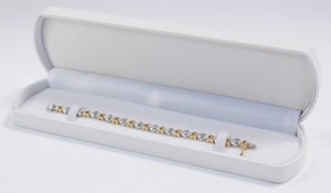 A baguette diamond bracelet, set in a white oval and yellow square metal link bracelet, stamped 14k, on a snap clasp, approximately 2ct, 18.3g. - 4