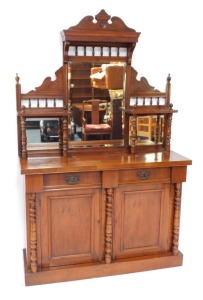 A Victorian walnut chiffonier, or side cabinet, the raised back with three bevelled mirrored plates, on turned supports, the base with two frieze drawers above to panelled doors, flanked by turned pillars on a plinth, 192cm high, 119cm wide.