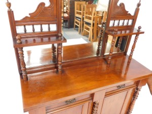 A Victorian walnut chiffonier, or side cabinet, the raised back with three bevelled mirrored plates, on turned supports, the base with two frieze drawers above to panelled doors, flanked by turned pillars on a plinth, 192cm high, 119cm wide. - 2