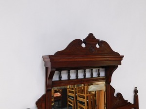 A Victorian walnut chiffonier, or side cabinet, the raised back with three bevelled mirrored plates, on turned supports, the base with two frieze drawers above to panelled doors, flanked by turned pillars on a plinth, 192cm high, 119cm wide. - 3