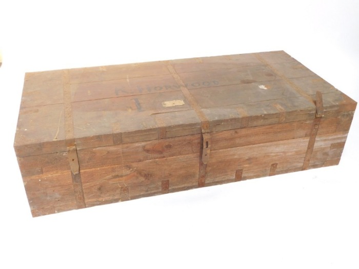 A 20thC Eastern teak packing case, with metal bands, painted name R Horwood, 35cm high, 145cm wide, 70cm deep. (AF)