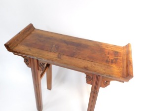 A Chinese or Korean elm small altar table, with plank top and raised sides, on channeled legs with scroll carved brackets, 85cm high, 84cm wide. - 2