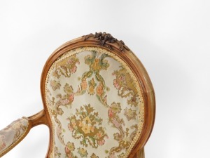 A Victorian rosewood show frame armchair, the moulded spoon shape back carved with flower heads, with a padded back, arm rests and seat in textured and patterned velvet, the arms with scroll carved supports, on cabriole legs, headed by leaf carving. - 2
