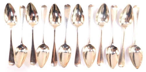 Twelve Dutch silver table spoons, monogram engraved, assay mark for The Hague, 22.10oz.