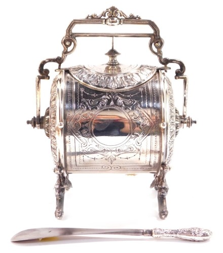 A Victorian silver plated biscuit barrel, of barrel form, embossed with acanthus leaves and with engraved decoration, with swing handle, 21cm wide, together with a shoe horn with silver handle, with floral and foliate embossed decoration, London 1872. (2)