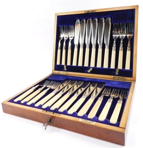 A silver plated fish canteen of cutlery, with silver ferrules and ivory handles, mahogany cased with brass escutcheons, for Fattorini & Sons, Sheffield 1907.