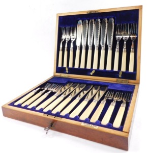 A silver plated fish canteen of cutlery, with silver ferrules and ivory handles, mahogany cased with brass escutcheons, for Fattorini & Sons, Sheffield 1907.